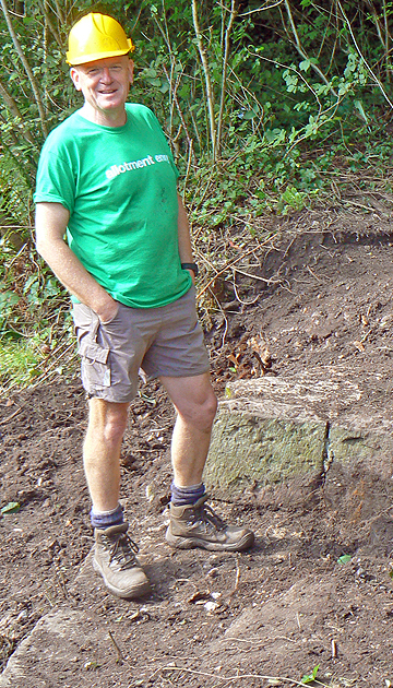 Ralph Mills standing beside a canal bywash