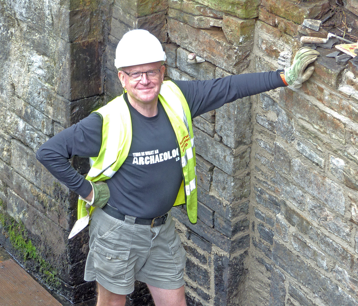 Ralph Mills standing in a sidused canal lock