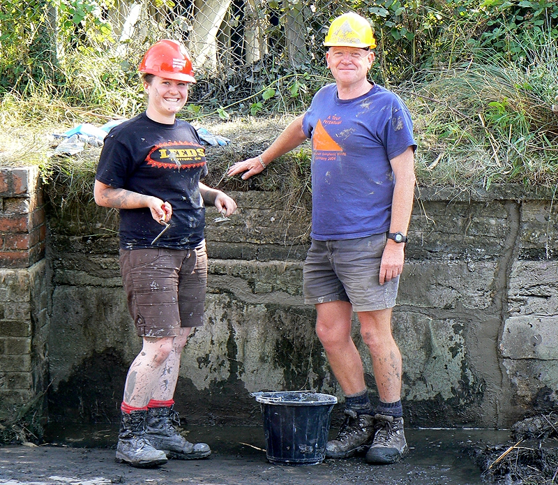 Ralph helping to repair a leaking aqueduct