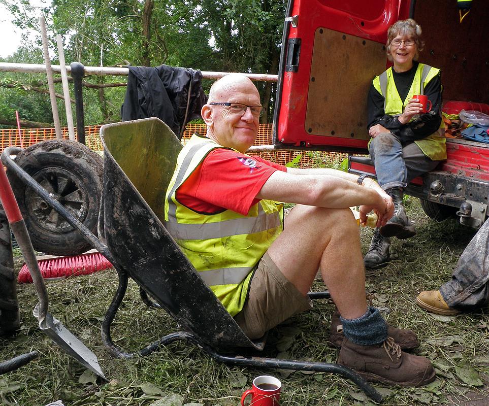 Ralph using a wheelbarrow as a chair